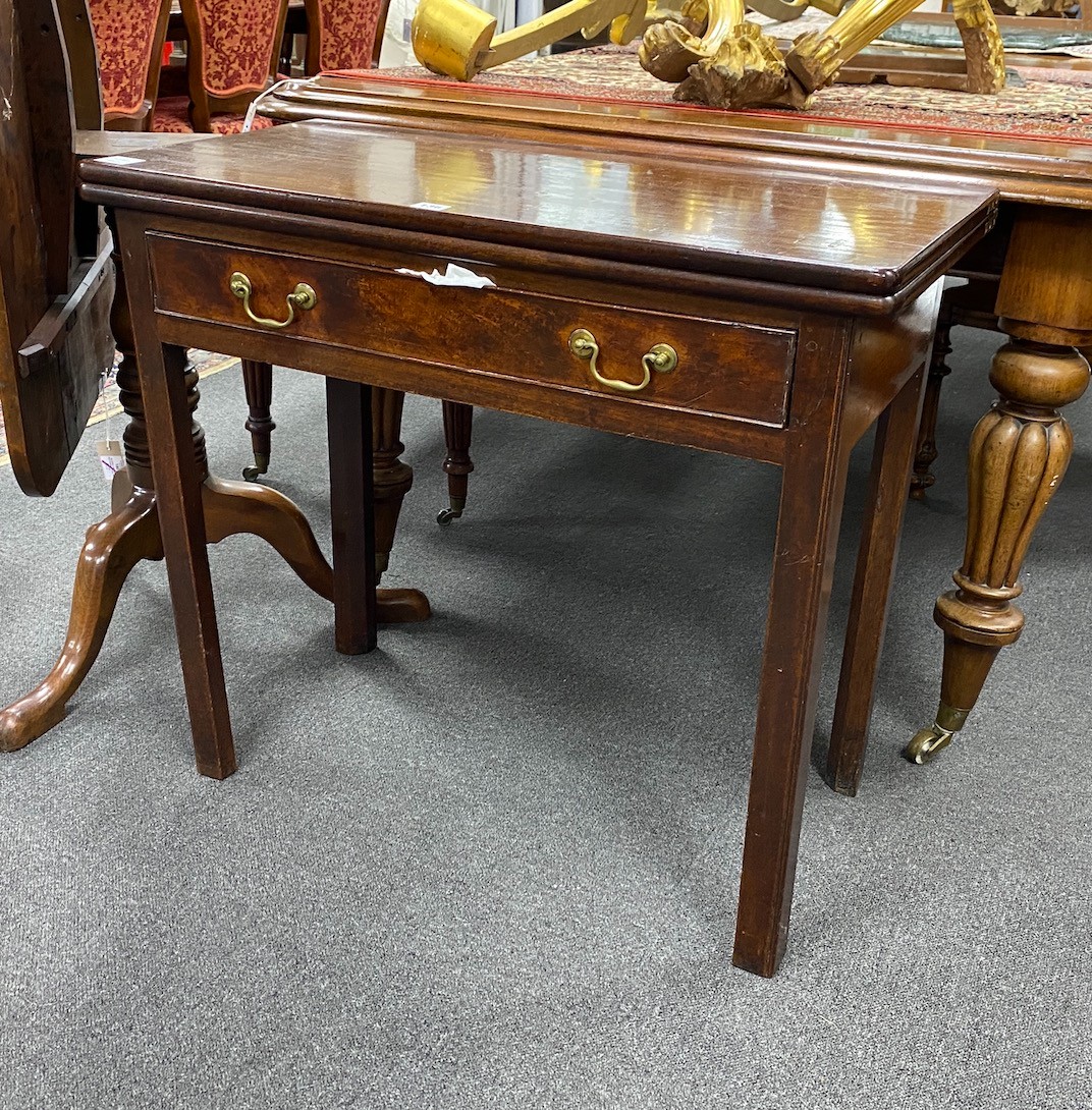 A George III rectangular mahogany folding tea table, width 84cm, depth 40cm, height 74cm